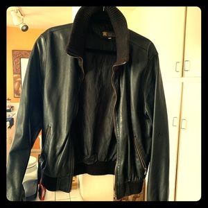 Black leather jacket with popped collar.
